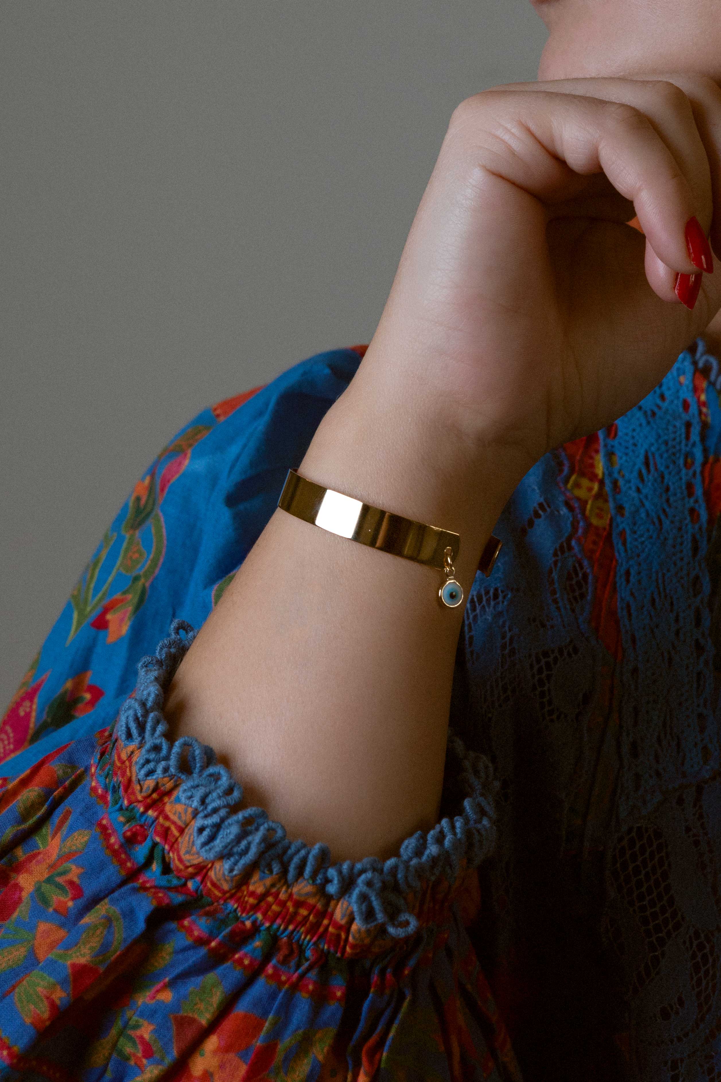 Gold-dipped evil eye bracelet with a protective design, crafted for everyday wear.