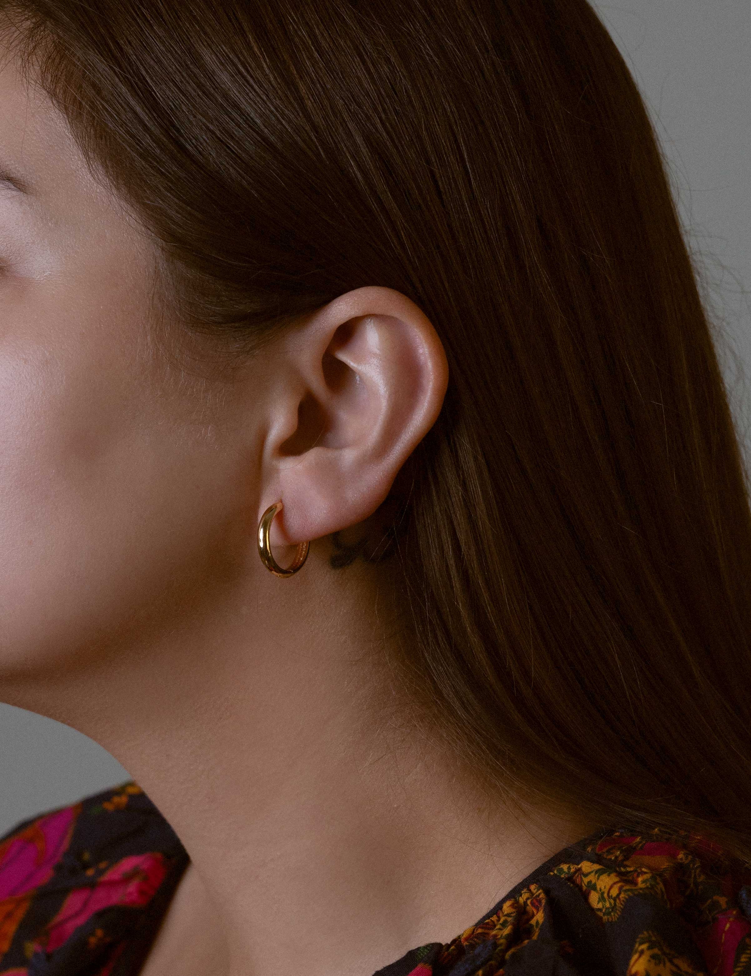 Brielle earrings with gold hoop earring set and small dangle earrings, a timeless and chic accessory.