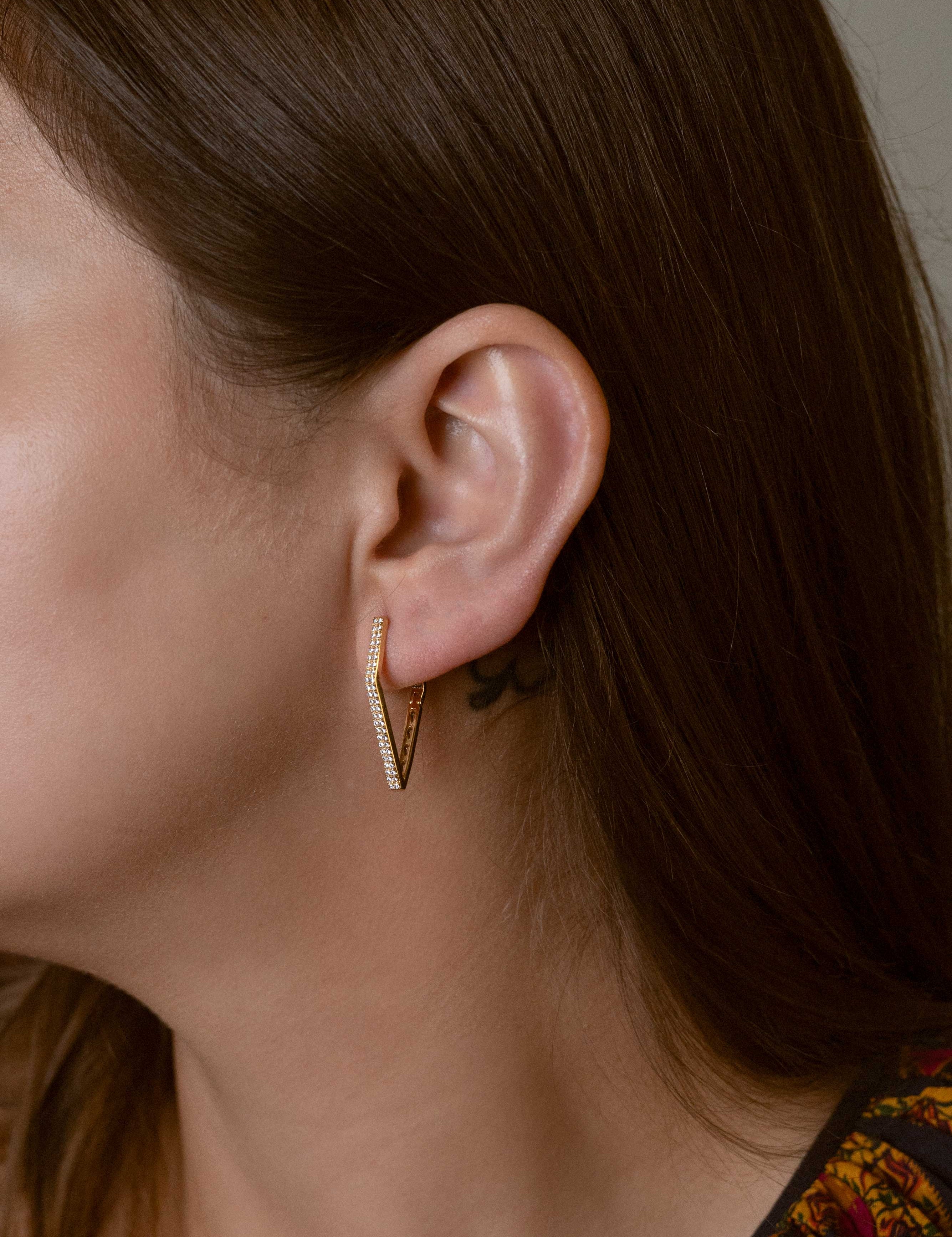 Harper earrings with gold hoop earring set and small dangle earrings, a timeless and chic accessory.