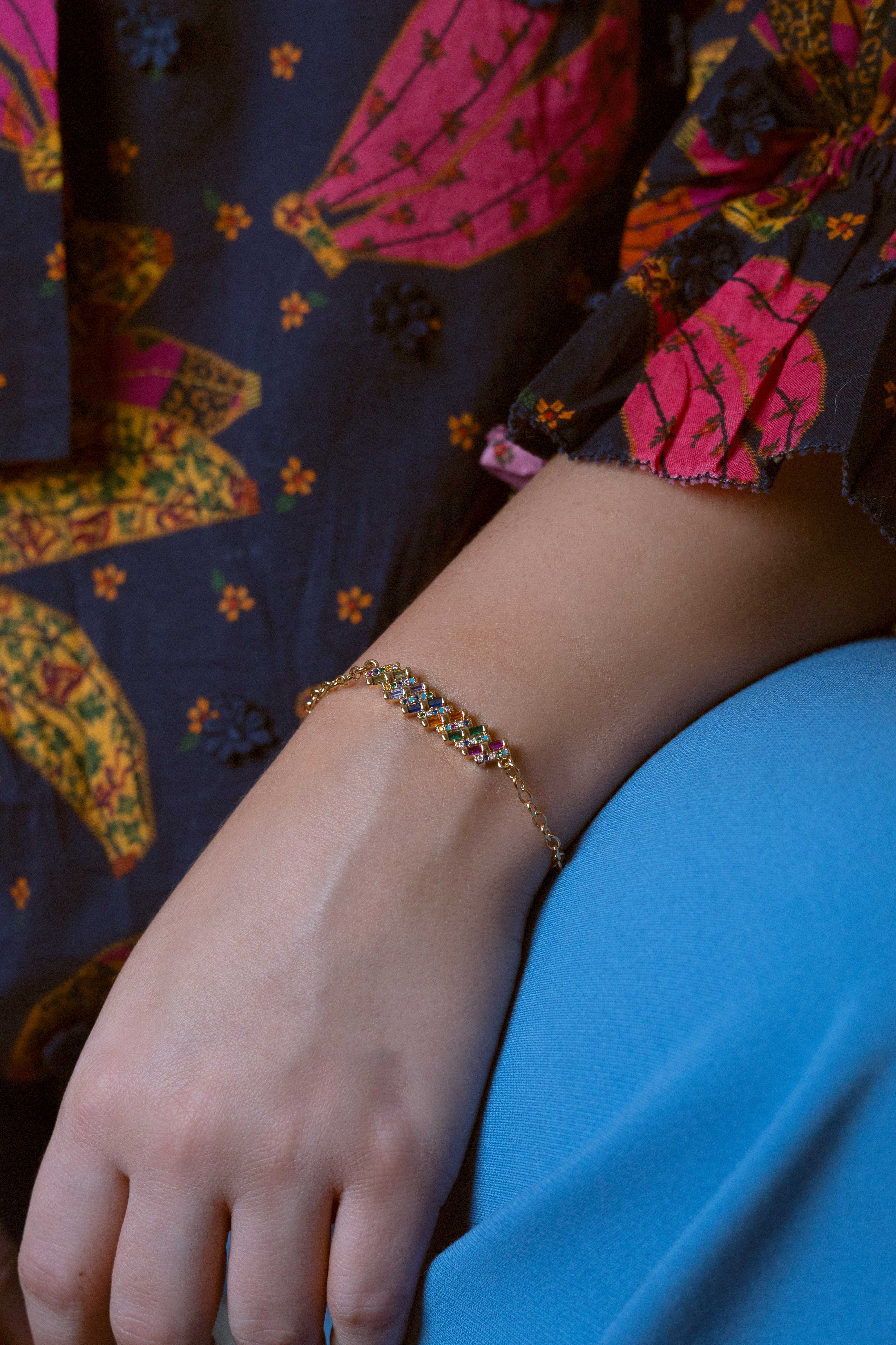 Slim gold-dipped bracelet with colored crystals, designed for a delicate and refined look.