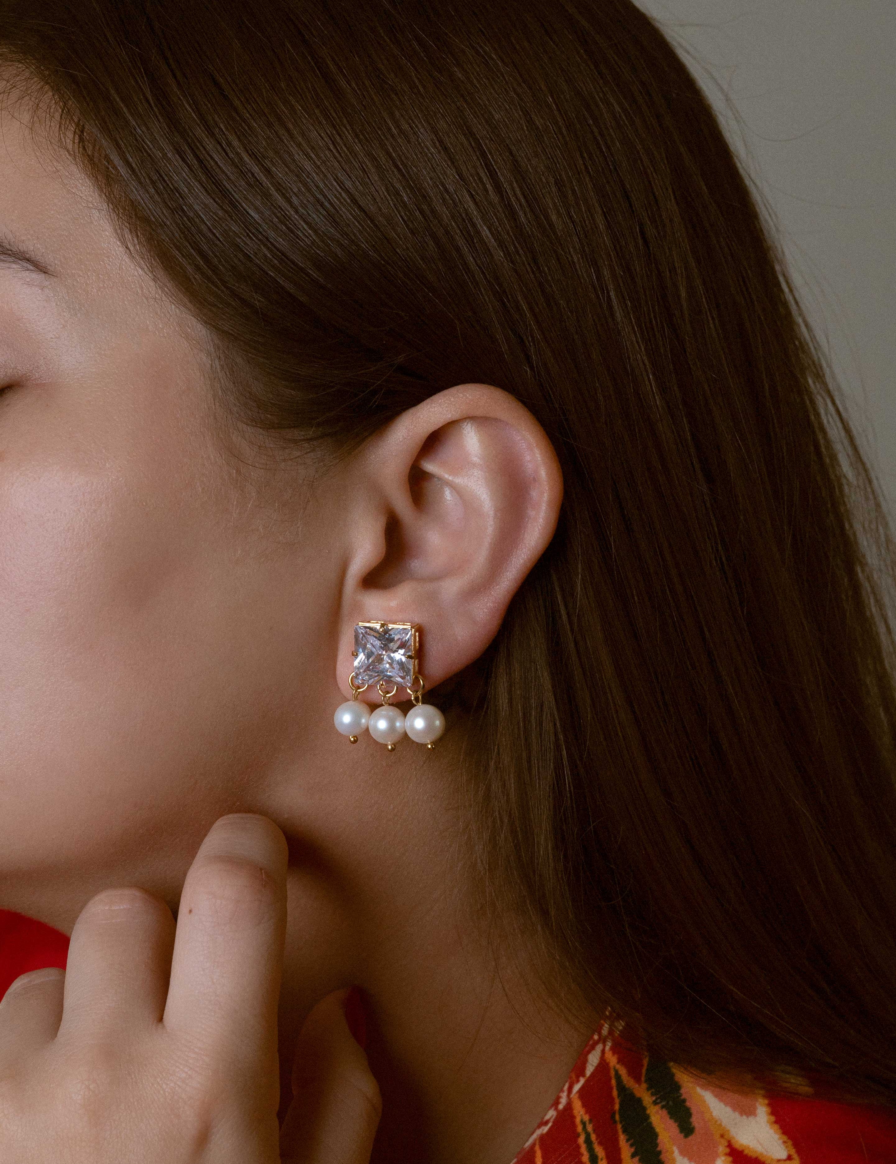 Lydia earrings with gold hoop earring set and small dangle earrings, a timeless and chic accessory.