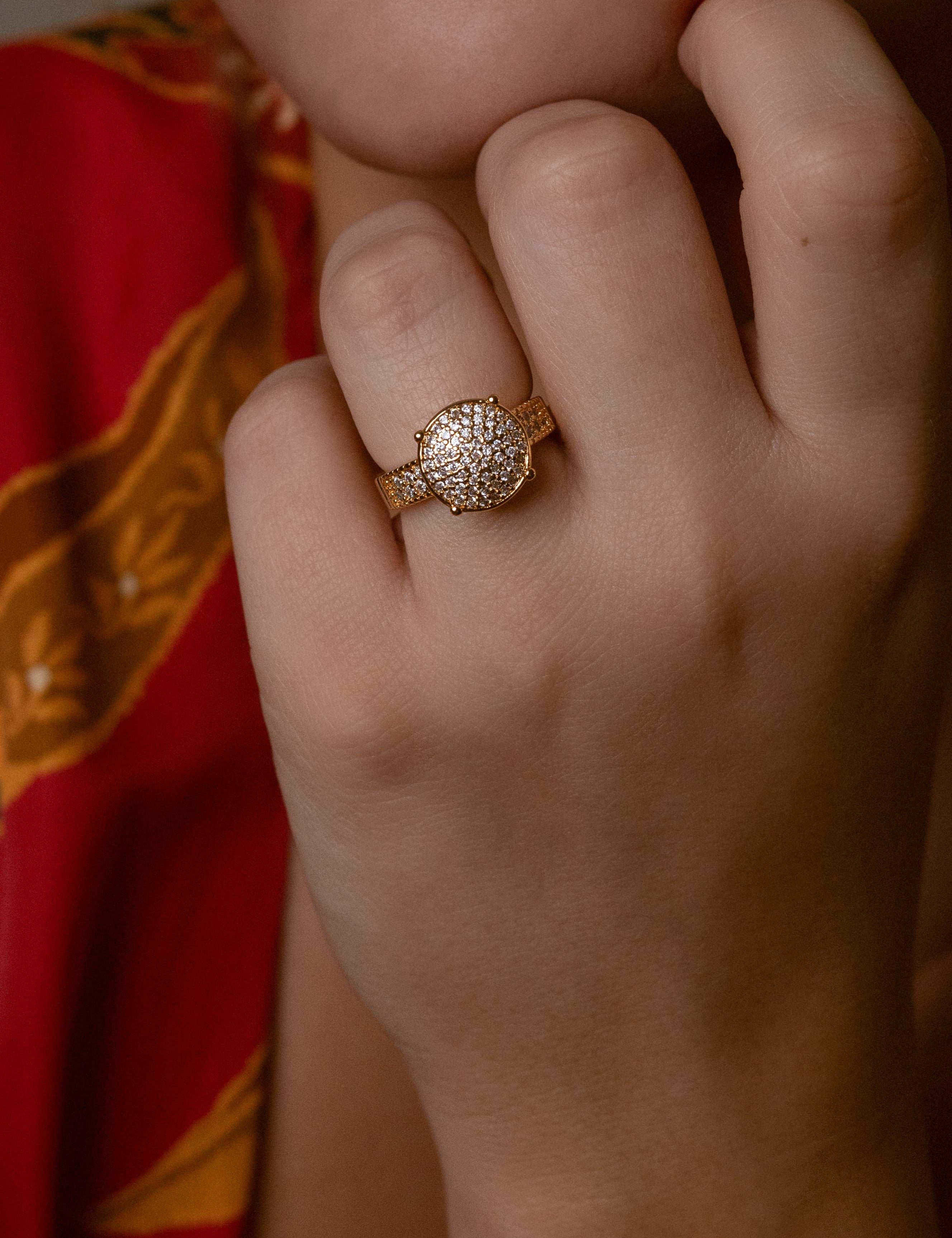 Luxurious 14K gold ring with studded zirconia design capturing light with brilliant sparkle, elegant Loon Concept jewelry