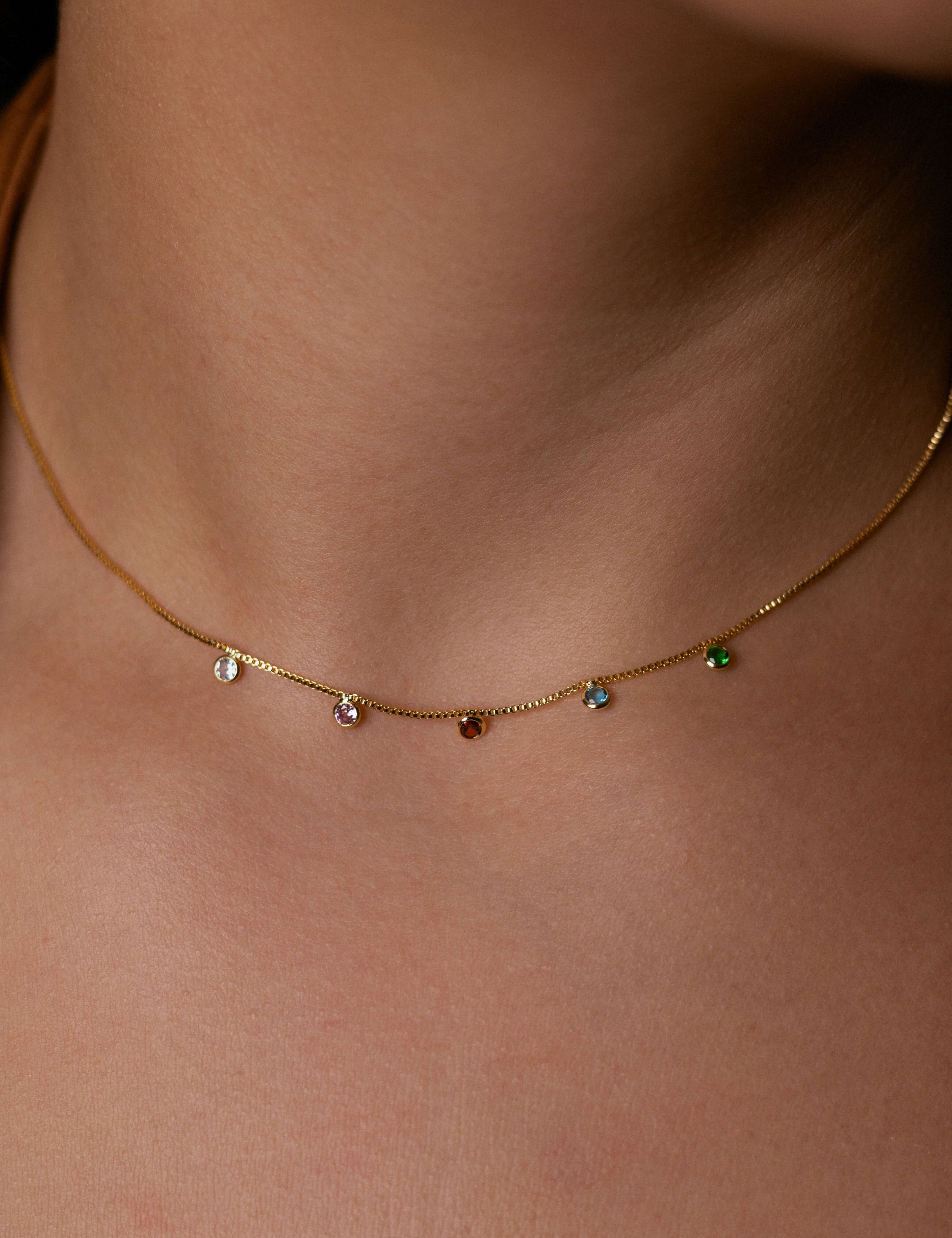 Gold-plated crystal pendant necklace with shimmering colored crystals