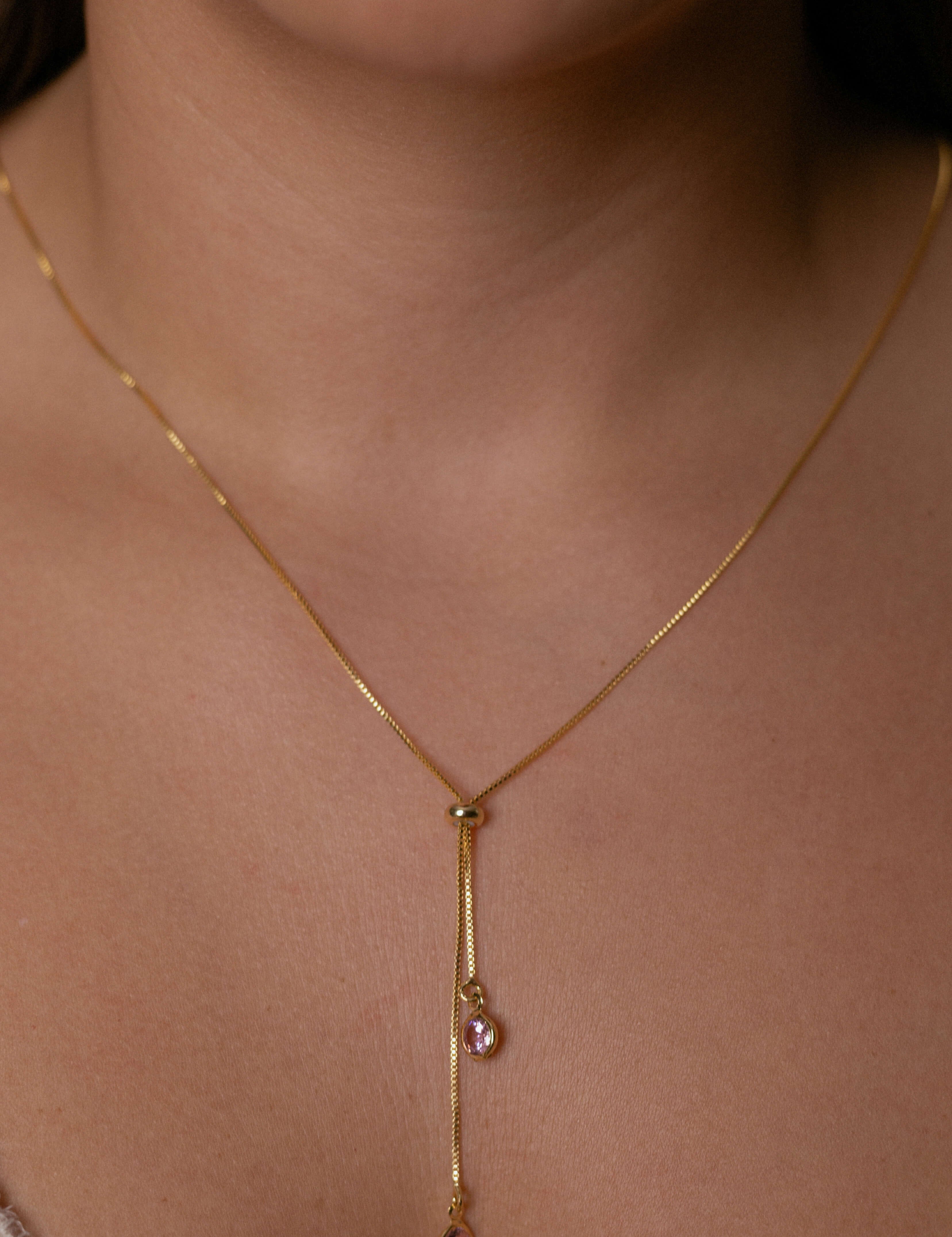 Adjustable crystal pendant necklace with gold plated finish