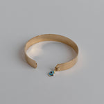 Gold-dipped evil eye bracelet with a protective design, crafted for everyday wear.