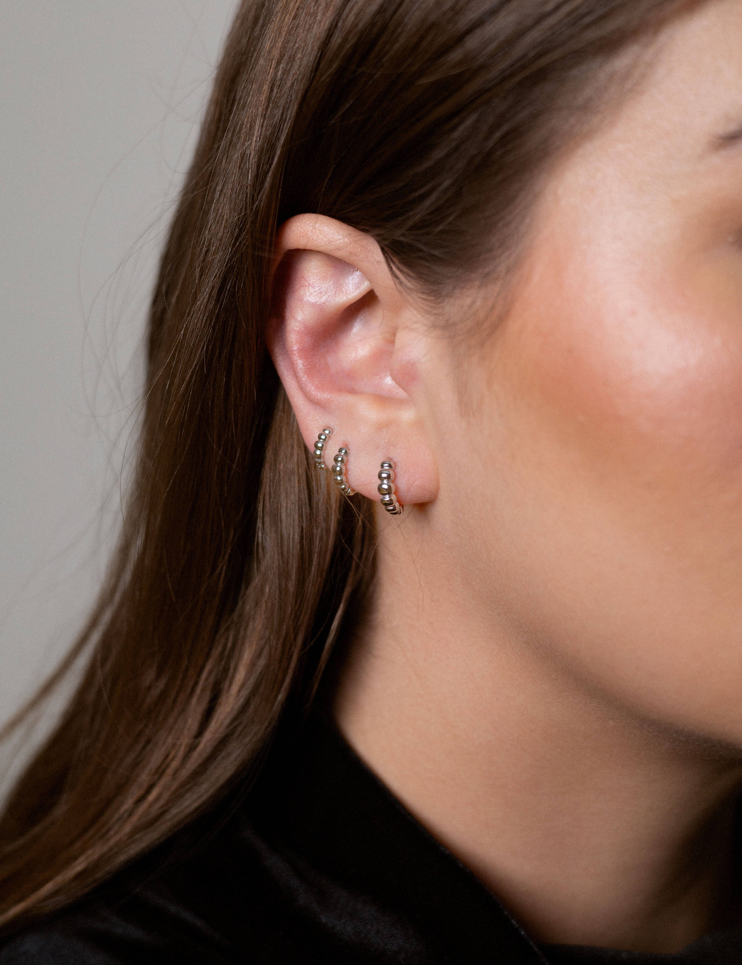 Brianna earrings with gold hoop earring set and small dangle earrings, a timeless and chic accessory.