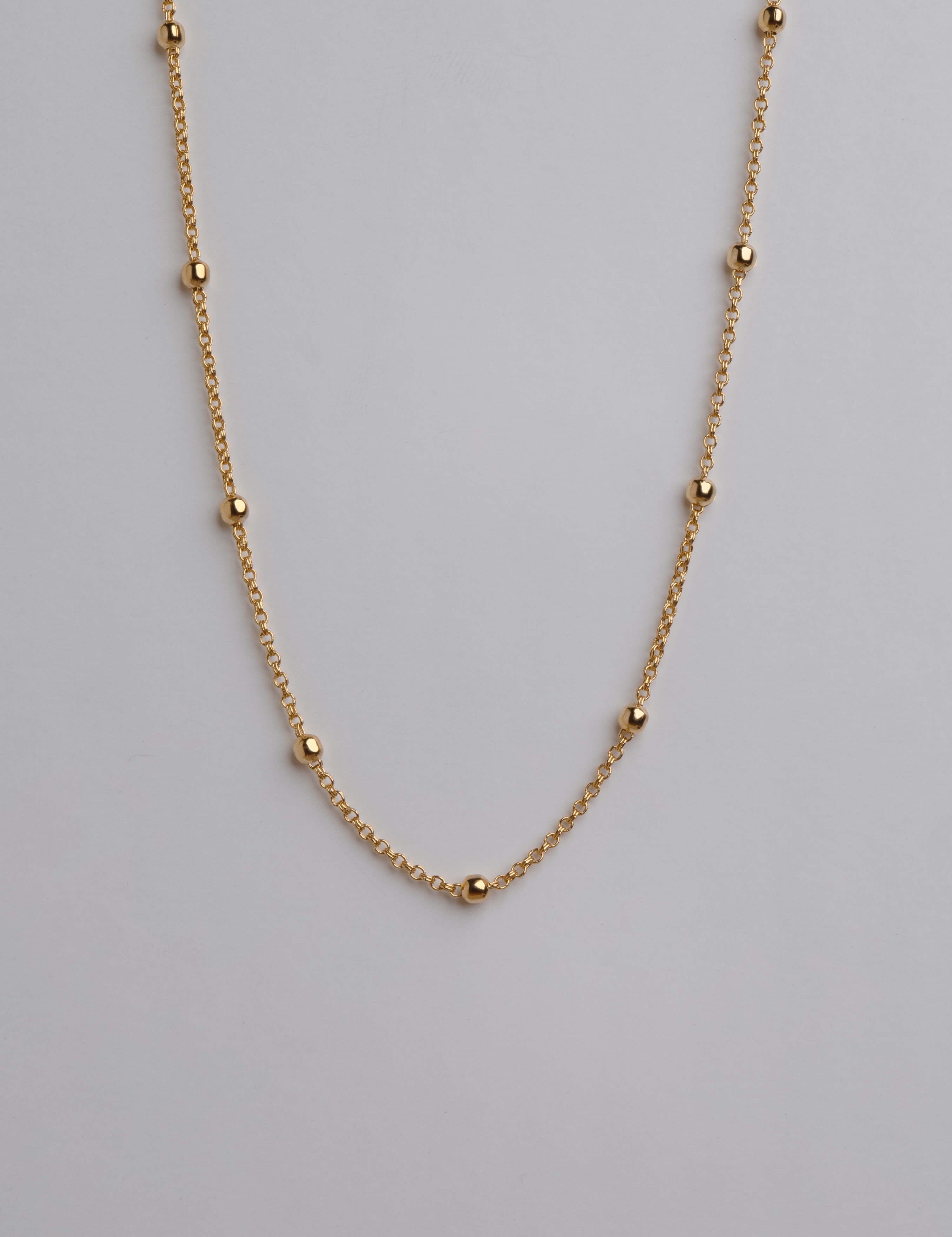 Gold plated necklace with small gold dots, 18K gold plated, hypoallergenic, and non-tarnishing