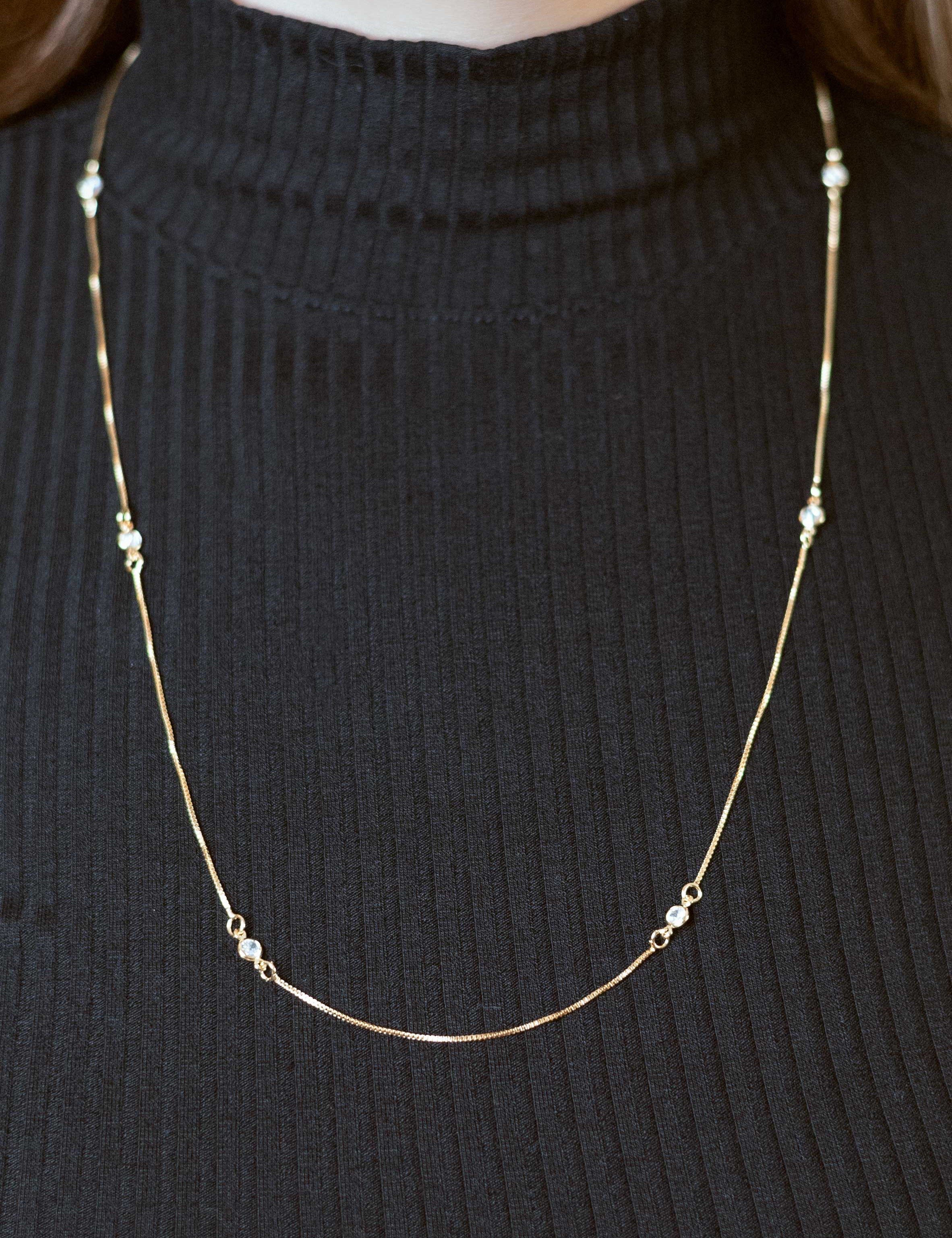 Minimalist long chain necklace featuring vibrant crystals